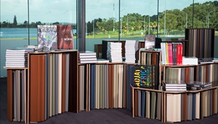 The shelving was formed using a LYSAGHT® gutter profile to provide the intimate feeling of a library. Sporadic patterning of BlueScope's new COLORBOND® steel colours - Basalt™, Wallaby™, Gully™, Cove™, Mangrove™ and Terrain™ - fixed to a plywood structure formed a representation of the rich texture of the outback.